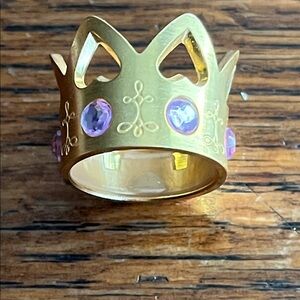 Gold Crown Ring with Purple Gemstones rotates